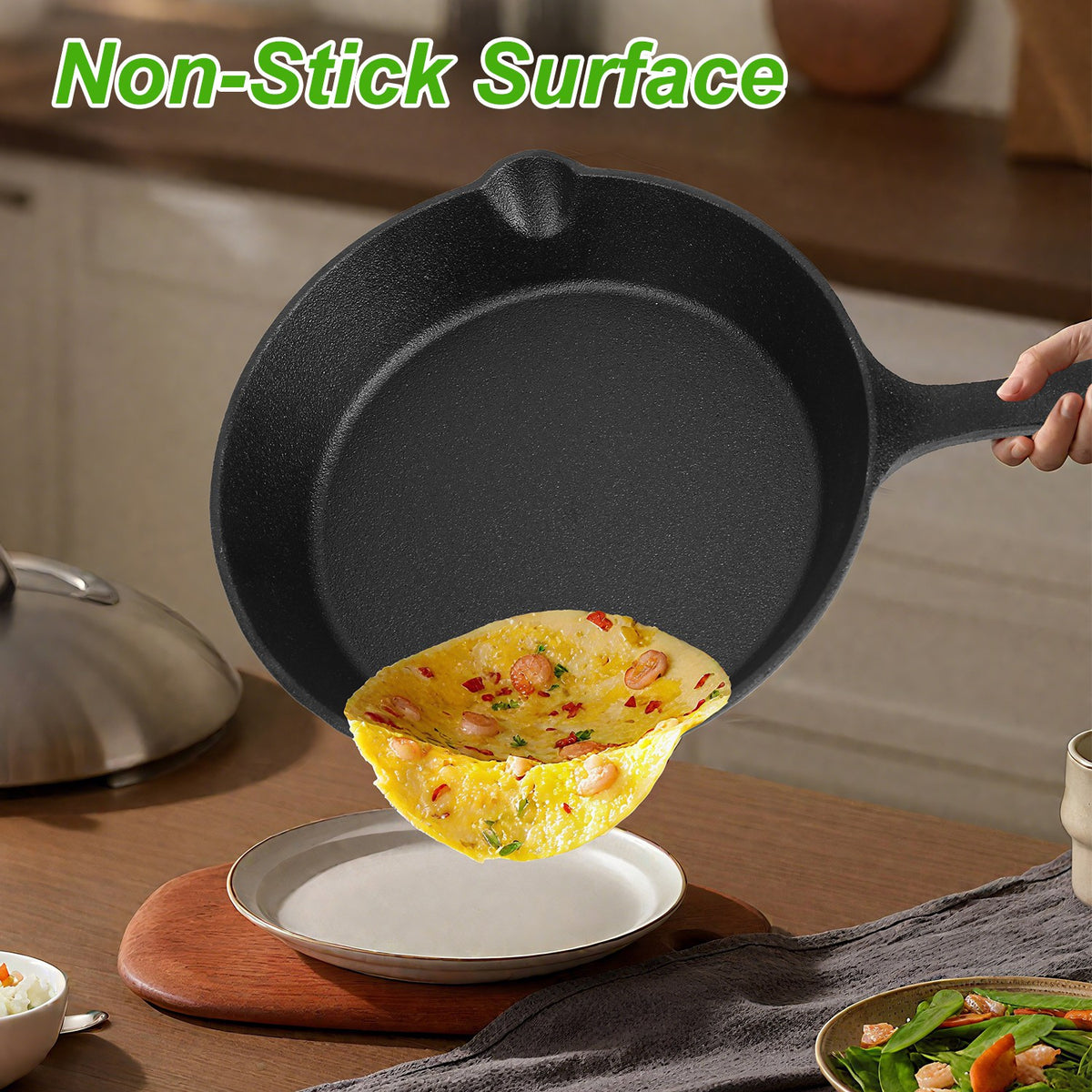 Black cast iron skillet with a cooked omelette on a wooden table