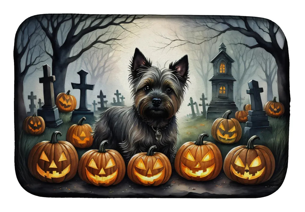 Dog surrounded by Halloween pumpkins and tombstones in a dark forest setting