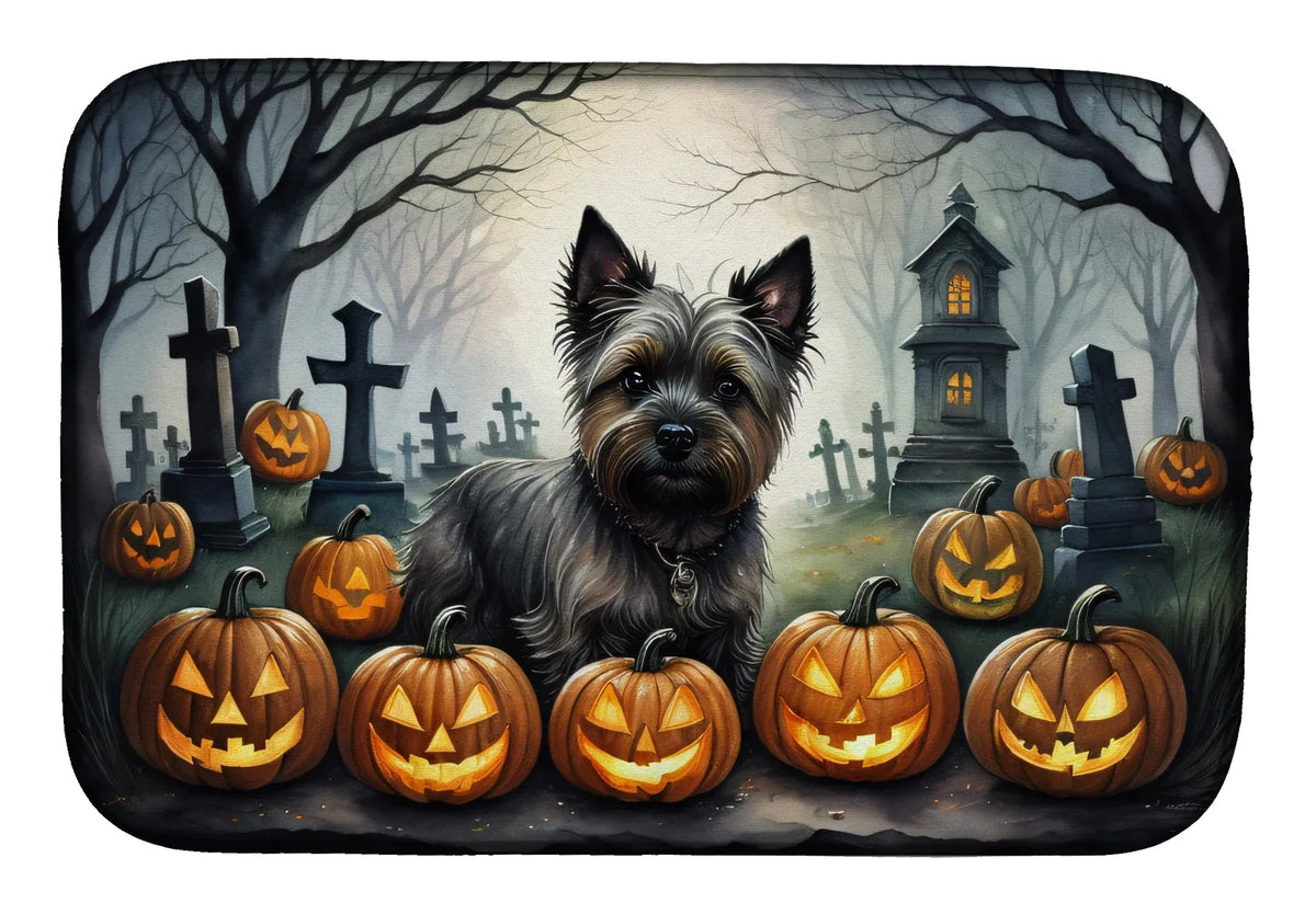 Dog surrounded by Halloween pumpkins and tombstones in a dark forest setting