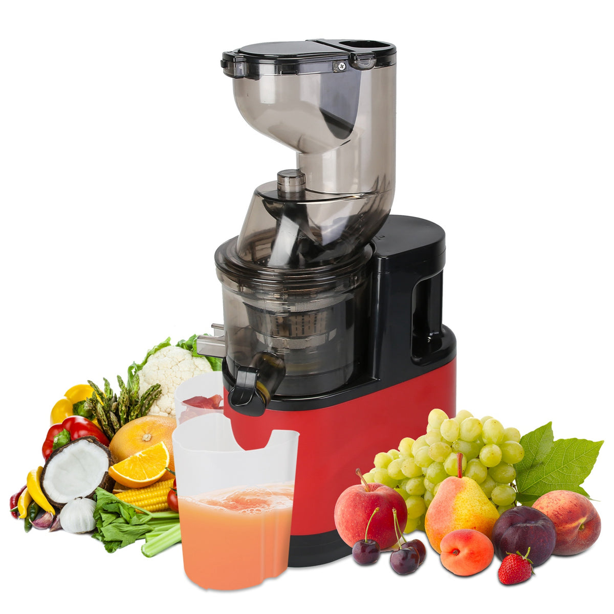A red and black electric juicer machine with a clear hopper, shown on a white background with fresh fruits, vegetables, and a pitcher of juice arranged around it.