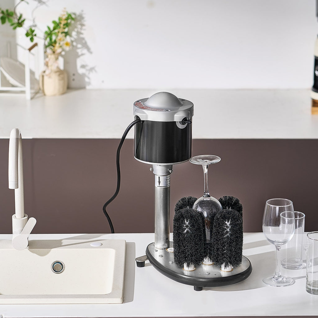 Dishwasher with a cleaning brush system on a kitchen counter.