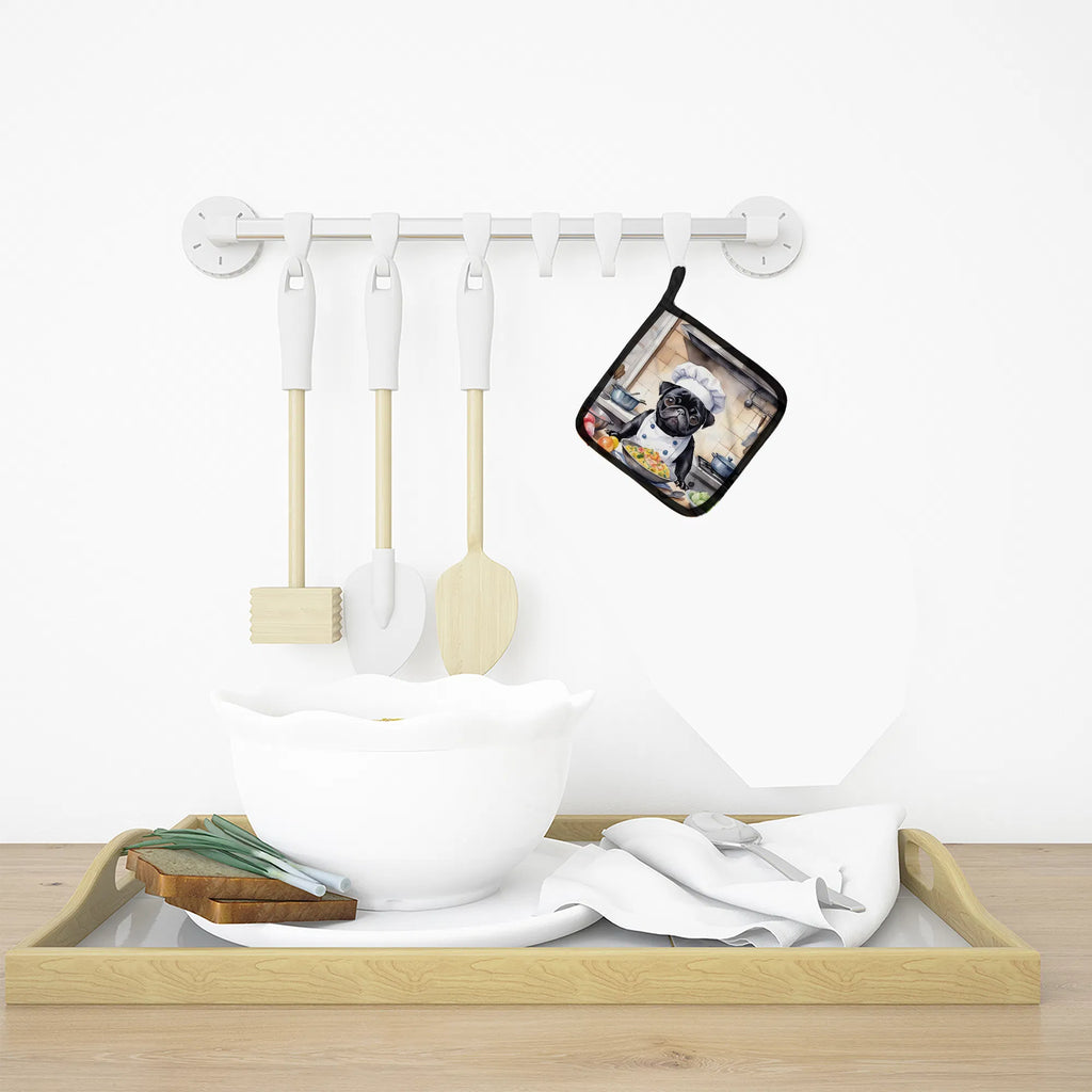 Set of kitchen utensils including spatulas and a pot holder on a white background