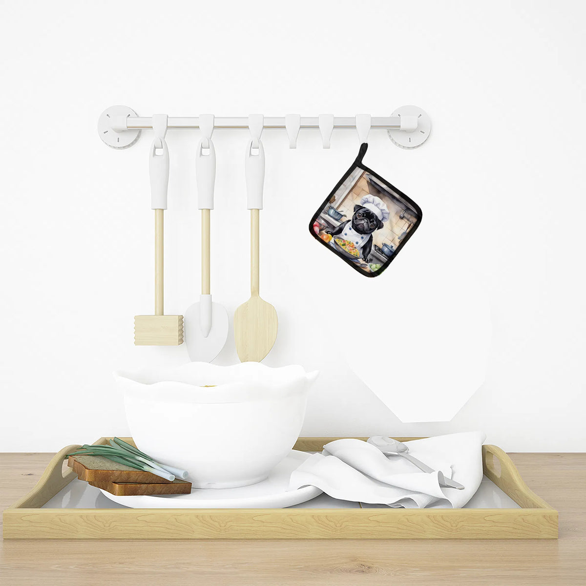 Set of kitchen utensils including spatulas and a pot holder on a white background